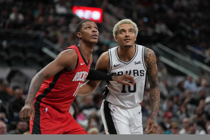 Oct 18, 2023; San Antonio, Texas, USA; Houston Rockets center Jock Landale (11) and San Antonio Spurs forward Jeremy Sochan (10) look for a rebound in the first half at the Frost Bank Center.